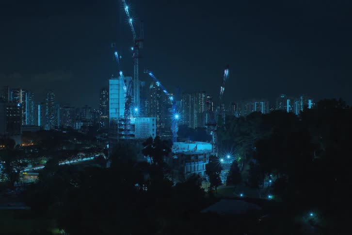 Two buildings are built fast at night