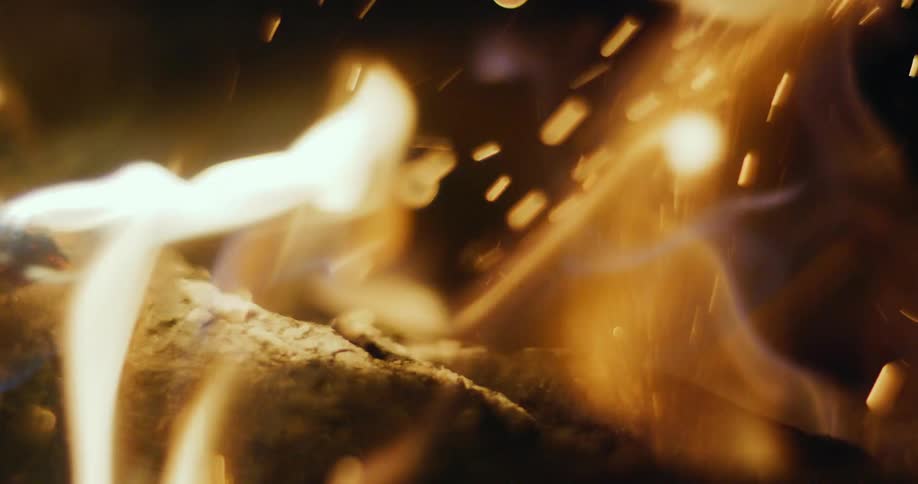 The logs are burning at night