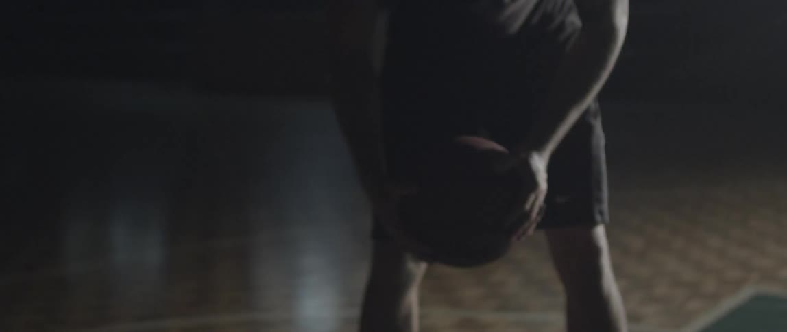 An athlete is holding a basketball