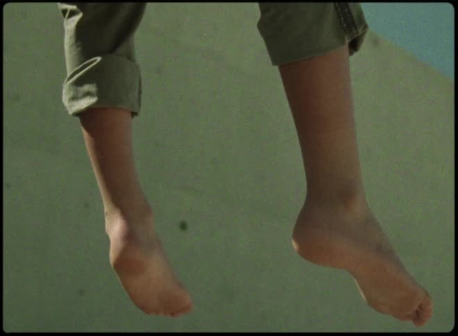 A persons legs are hanging down