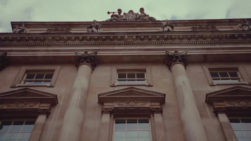 The building has statues at the top