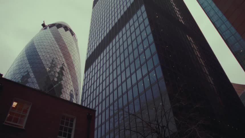 The gherkin in downtown London at dusk