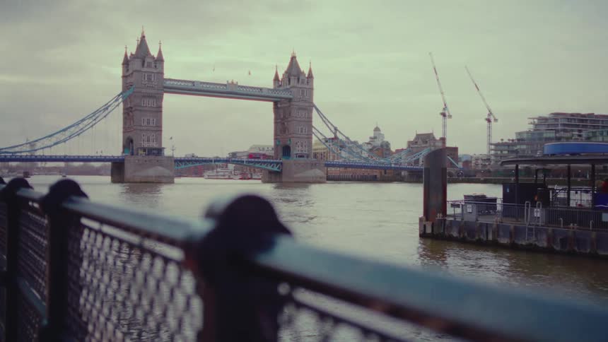 London bridge during day time with cars and busses passing by