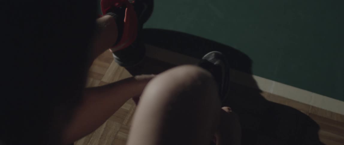 A person puts on their sneakers