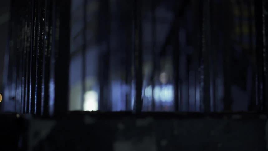 This area is surrounded by bars and is dark