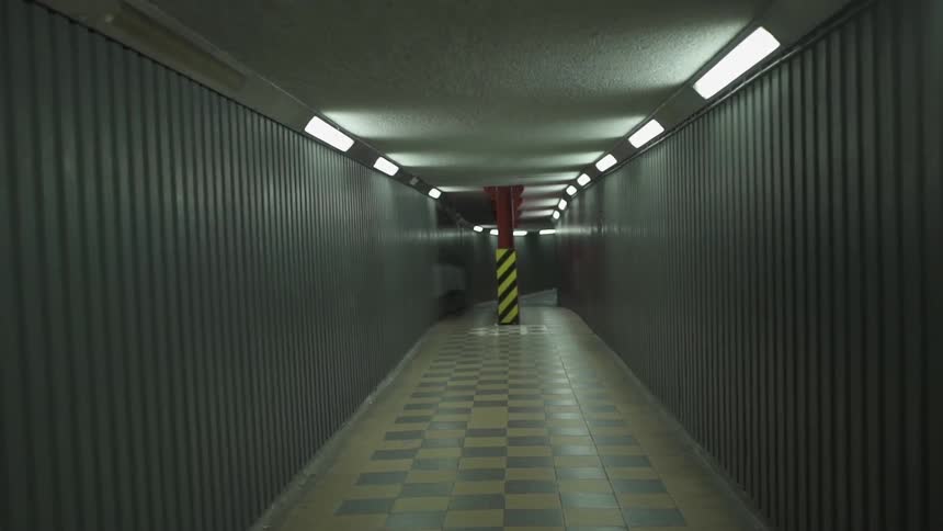 A long hall is lined with lights