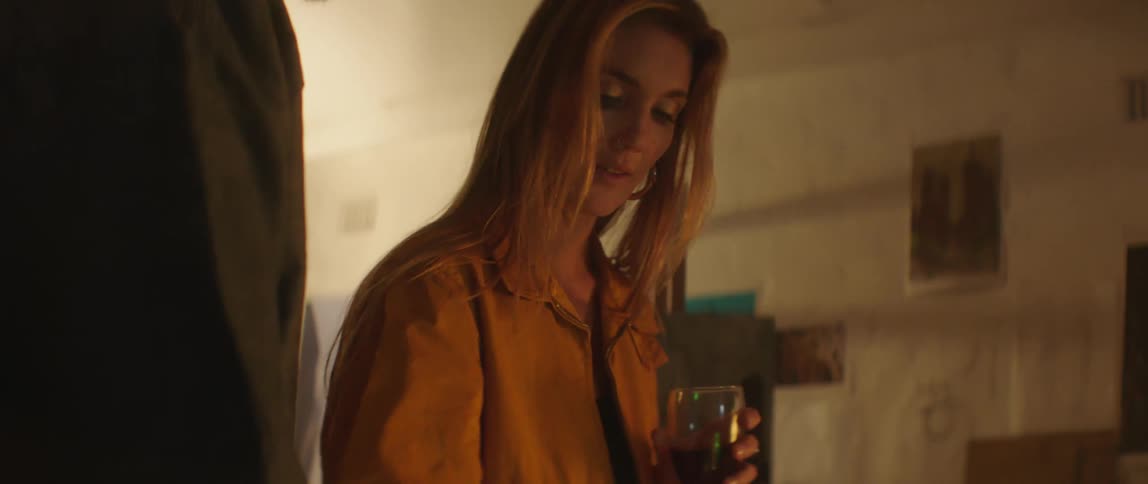 Man and woman are talking together and drinking wine