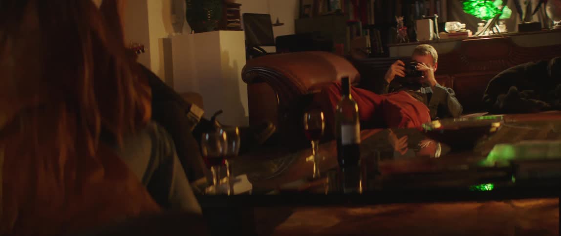 A group of friends are hanging out and drinking together