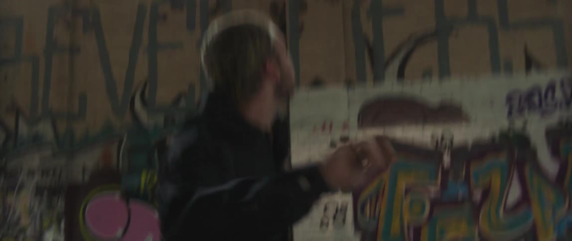 A man throwing a ball indoors