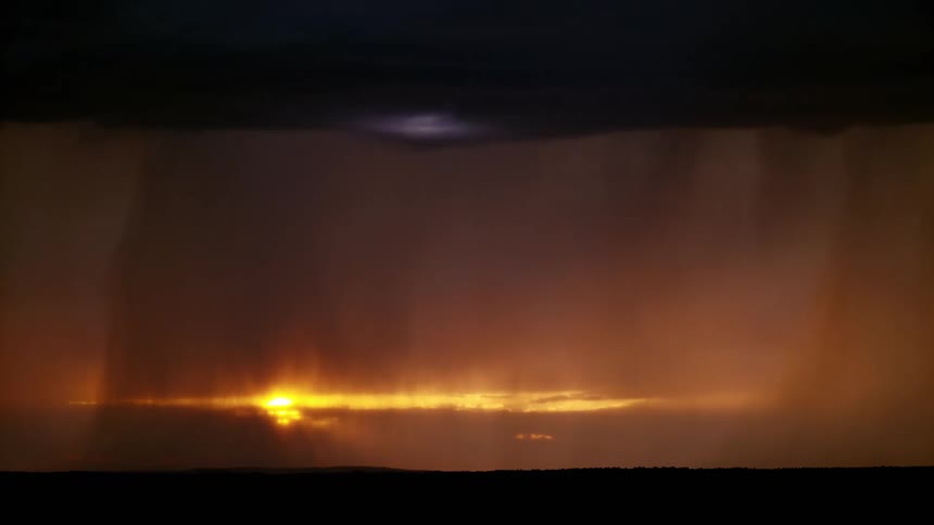 Several bolts of lightning spread throughout a stormy night sky