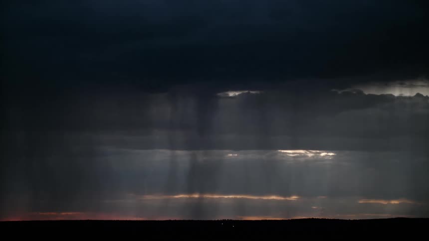 A storm is giving off rain and lightning