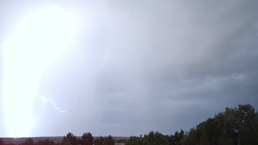 Lightning shoots from the clouds in the sky