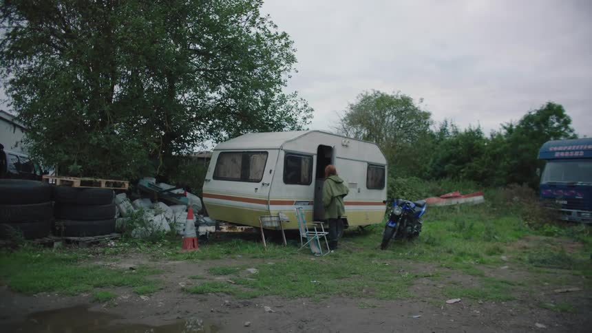 Woman walking and getting inside the motorhome