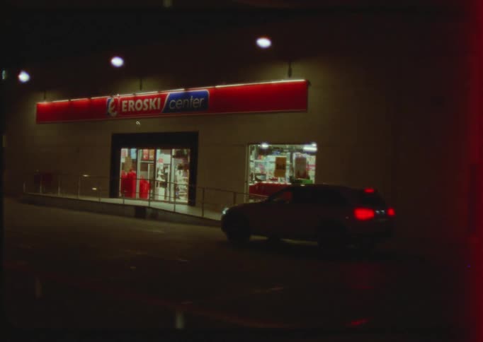 Exterior view of supermarket at night