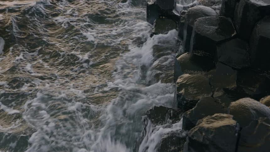 Sea waves crashing on the shore of the beach