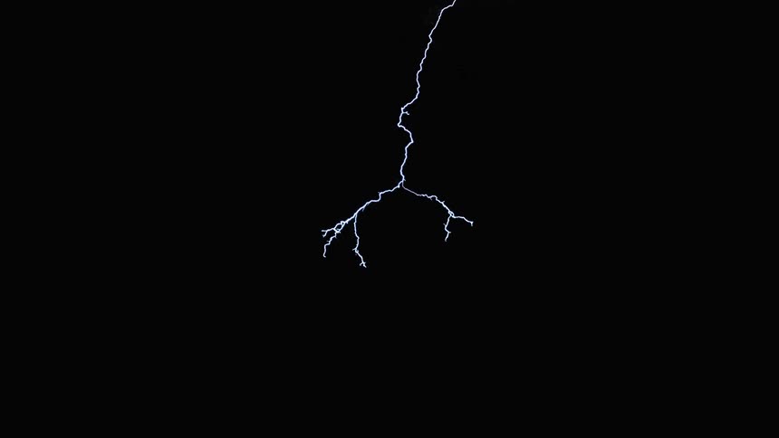 A heavy lightning storm cutting through the night sky in slow motion