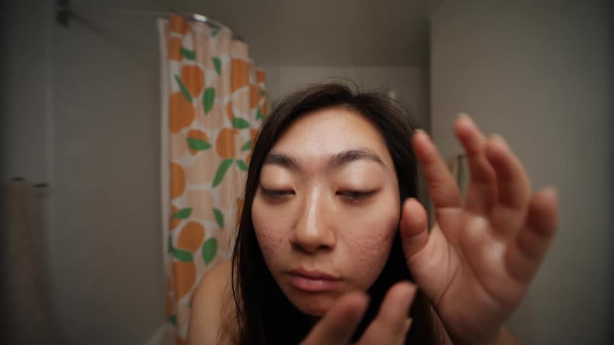A woman puts in her contacts