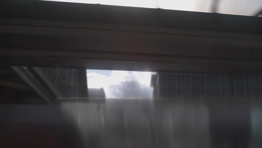 Moving past buildings on a cloudy day