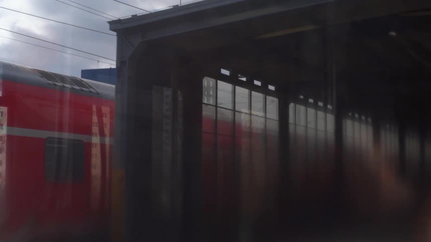 A train is moving on a cloudy day