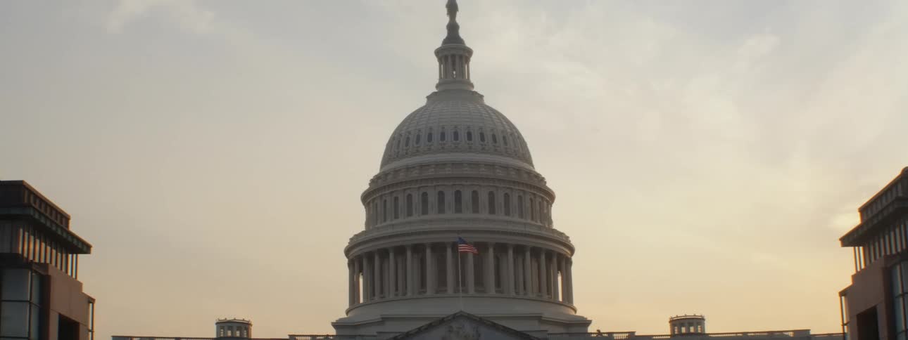 A flag flying in front of the monument