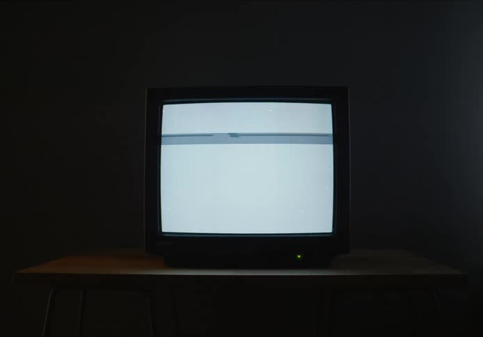 A television screen where several white and blue lines flicker up and down