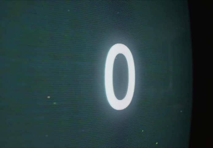 Close up ofnumbers counting up on an old television screen