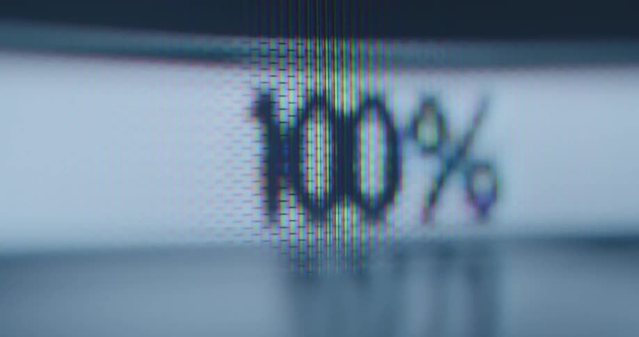Dynamic handheld macro shot of a loading bar symbol measured in percent or % on a pixelated digital screen fills up and then drains rapidly creating climax tension suspense during the charging download or upload process