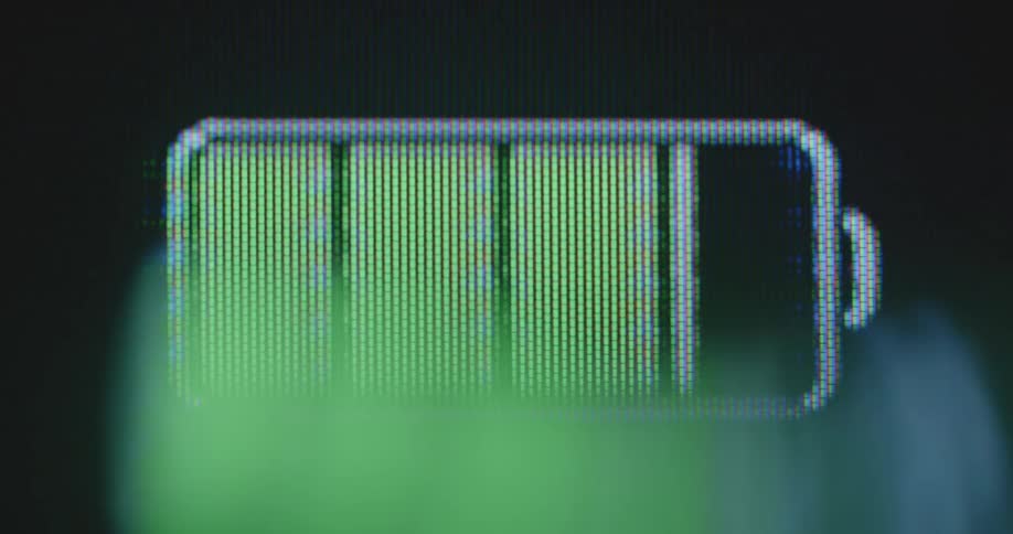 The green and red rechargeable battery indicator is going up and down while fast charging and draining as the energy level changes due to rising electricity consumption and high demand for an environmentally friendly renewable energy revolution