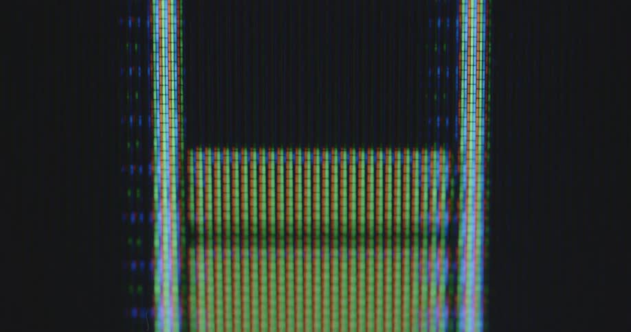 An accumulator icon gauge displayed on TV screen with rgb pixels indicates that a rechargeable high capacity smartphone battery is being fully drained and charged during a full charging cycle based on wireless or induction charging