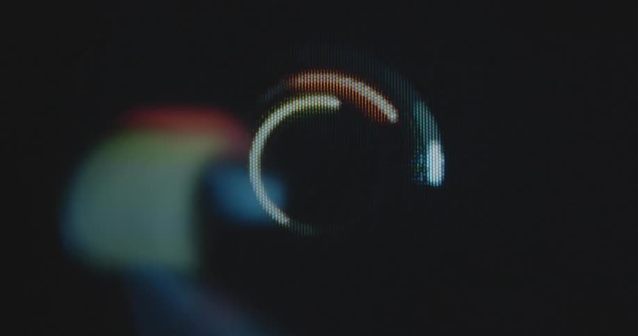 Three digital lines in the bright neon colors red yellow and blue spin in a circle animation with dynamic movement and transformation on a retro rgb tube television screen or computer display