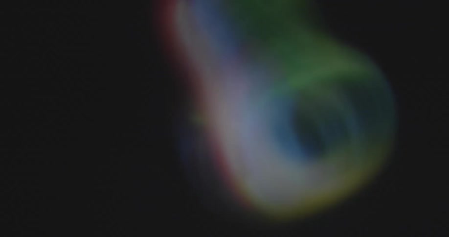 A symmetrical multi-colored rainbow circle spins on pixelated display in the colors of the flag of the LGBT and LGBTQ or LGBTQ+ movement as a symbol for queer power or pride and diversity