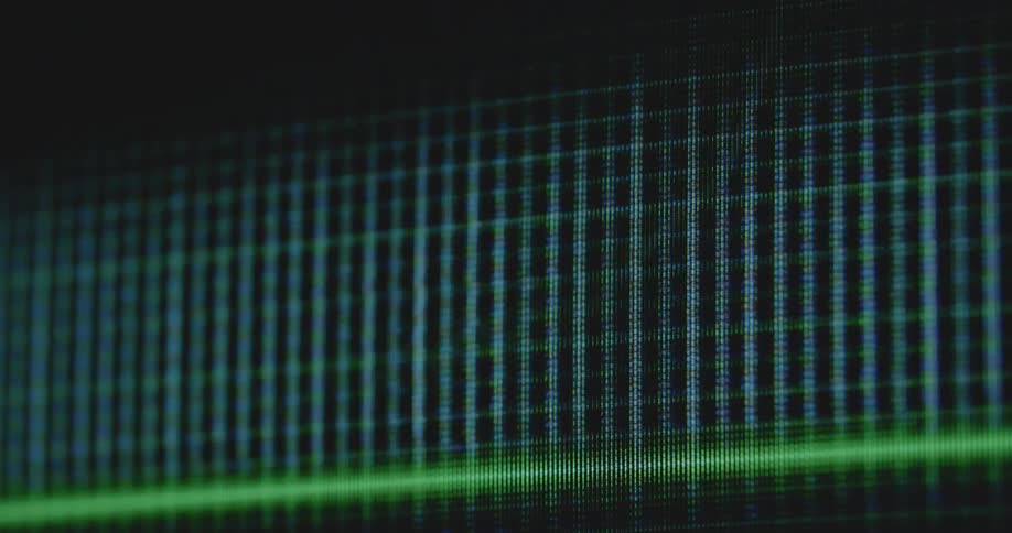 Close up of pixelated investment graph going up during an upward trend as a symbol for rising stock market and financial freedom and success during economic growth on an old TV or computer screen showing a finance app
