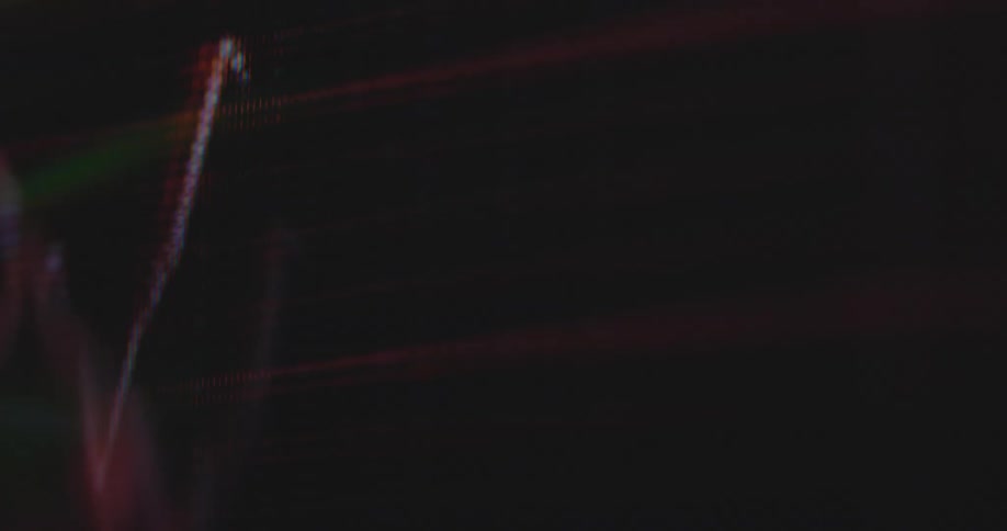 Shaky handheld dynamic closeup of a neon red stock graph line falling and going down causing stress and panic sales due to downward portfolio tendency caused by wrong decisions and bad investment mistakes on old pixelated computer screen