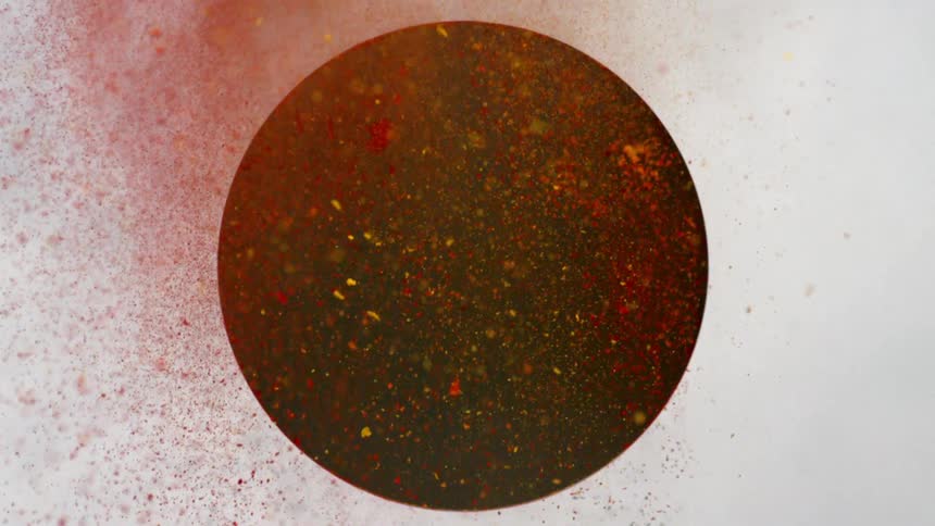 Red and yellow dirt fly out of this hole