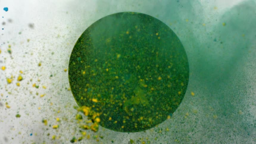 Green and blue dirt mix together moving out of a hole