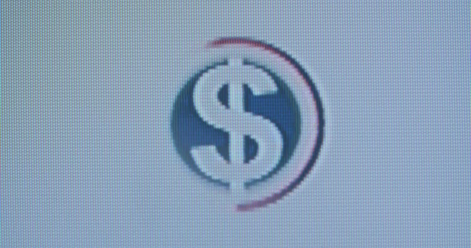 Red and blue US dollar sign flashing on the screen with white background representing the economic power of the financial sector of the United States of America and central bank and international success of the Wall Street stock exchange
