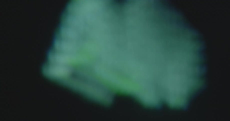 The neon green numbers zero or 0 and one or 1 in the shape of letters AI are changing on a dark black TV or computer display animated by an Artificial Intelligence based on computer science and machine learning