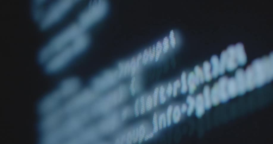 A screen shows multiple lines of text and characters scrolling past of a cyber attack performed by a hacker cracking a safety programme to gain access to encrypted sensitive data protected by security software and a strong password