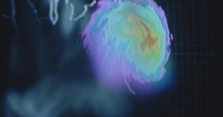 Colorful lights on a pixelated television screen indicate a tropical storm or hurricane building on the eastern coast of the US getting hit by the elements caused by extreme weather changes and phenomena displayed on geographical map