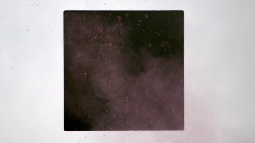 Dirt and smoke fall in front of a square