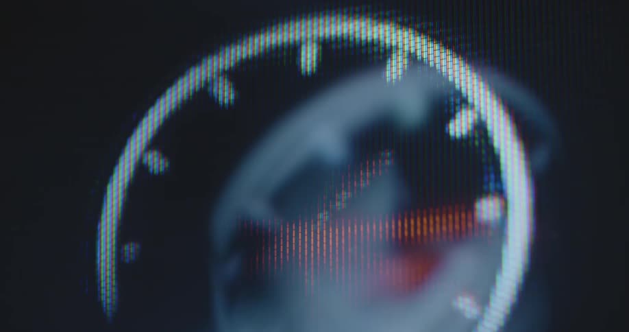 A closeup of a computer screen displays a rapidly moving wall clock or watch icon as a high-speed countdown counting down the time causing anxiety and restlessness making you feel stressed out and nervous