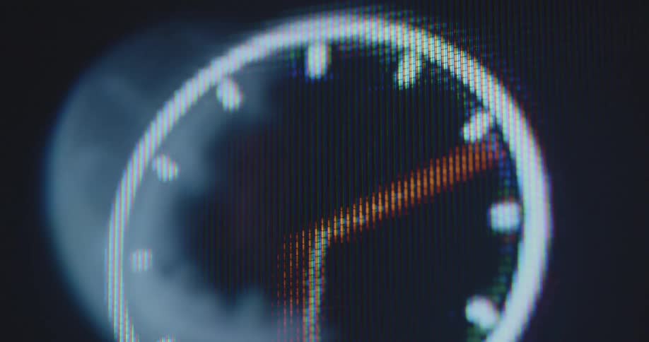 Clock hands on distorting pixelated digital image of clock rotate rapidly and illustrate time passing faster than in real time all day long 24/7