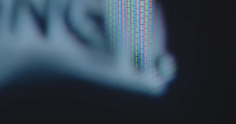 Extremely detailed macro shot of a loading bar graphic with blinking and flashing dots or periods fills up and drains repeatedly creating climax tension and suspense while the download or upload process is progressing on an old windows computer