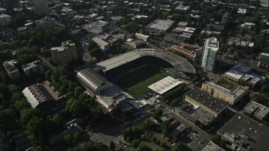 Aerial view of a high school football field and Major League soccer field in downtown Portland Oregon during a sunny day