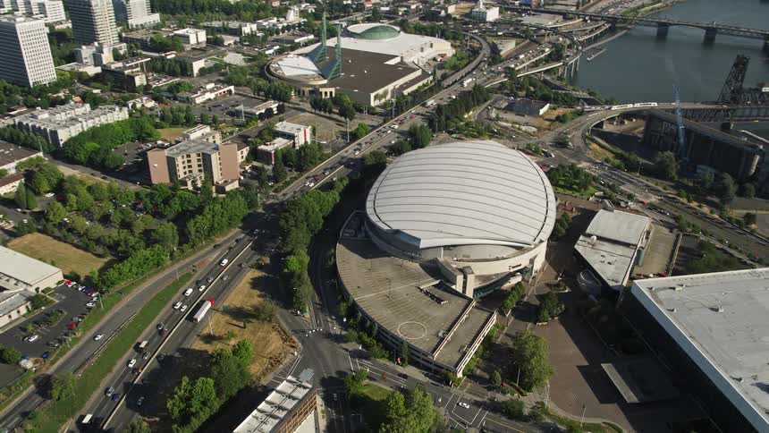 Aerial view of downtown Portland Oregon with the Moda Center arena and Willamette River in the background