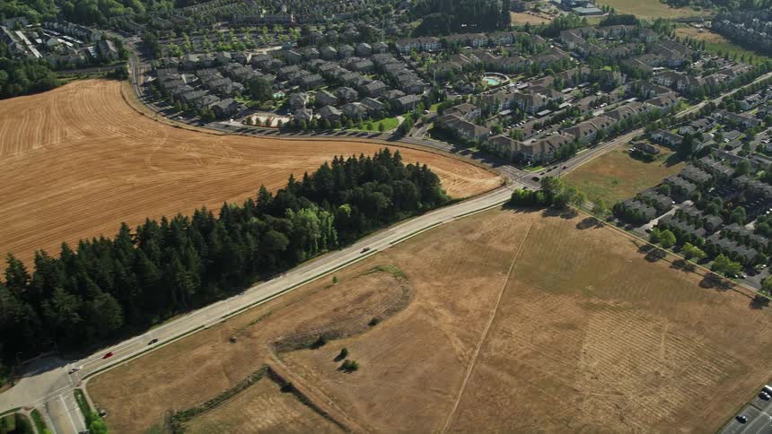  aerial footage of a sunny day flying over a residential neighborhood farmland and the Oregon National Primate Research Center in Hillsboro showcasing the beauty of the Pacific Northwest during summer
