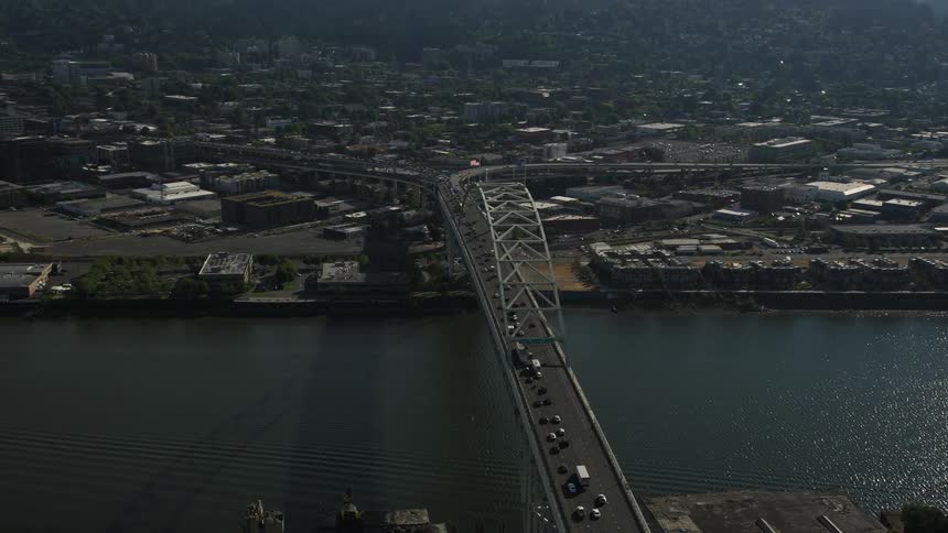 Aerial footage of downtown Portland's Fremont Bridge offering a panoramic view of the city's high rise buildings and the Willamette River