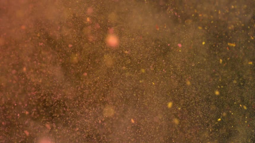 Colorful powder flies through the air and collides