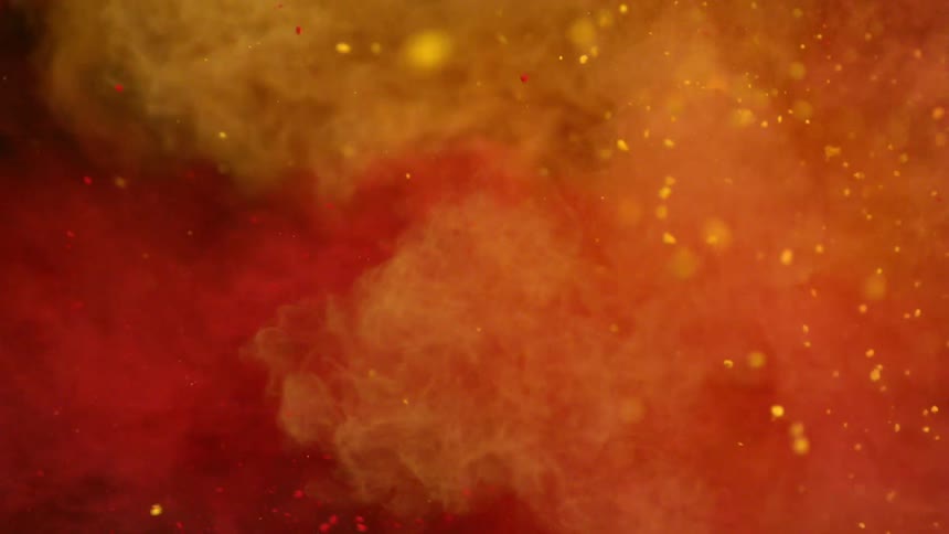 Red clouds of dirt followed by yellow fly into the area together