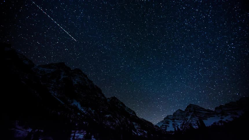 The stars are moving around above these mountains